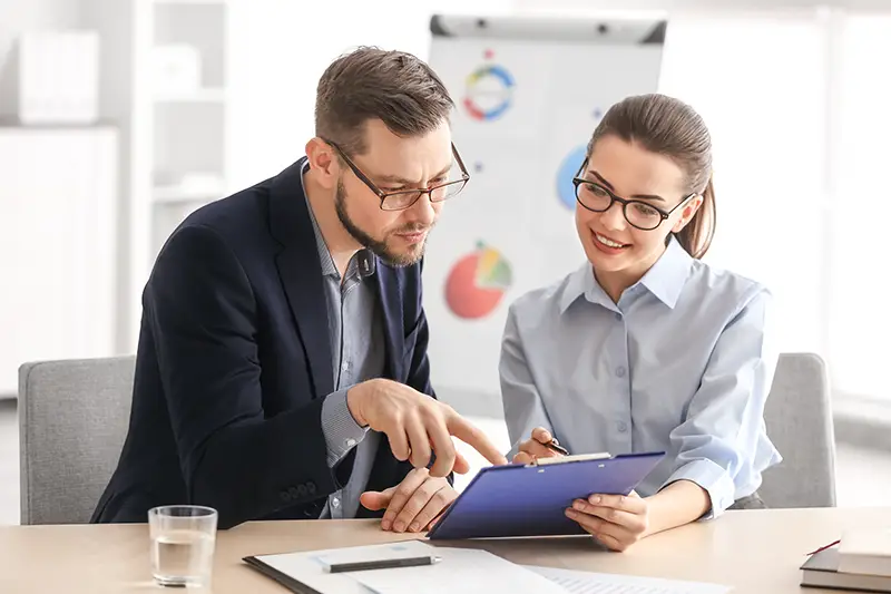 Young managers discussing issues in office