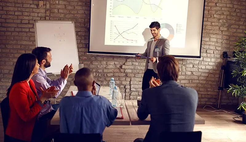 Male holding business presentation about success in business