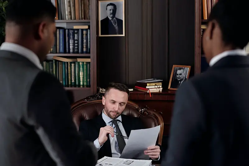 Male lawyer sitting on his chair near the desk