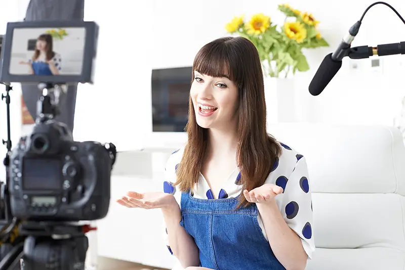 Female Vlogger Recording Broadcast At Home