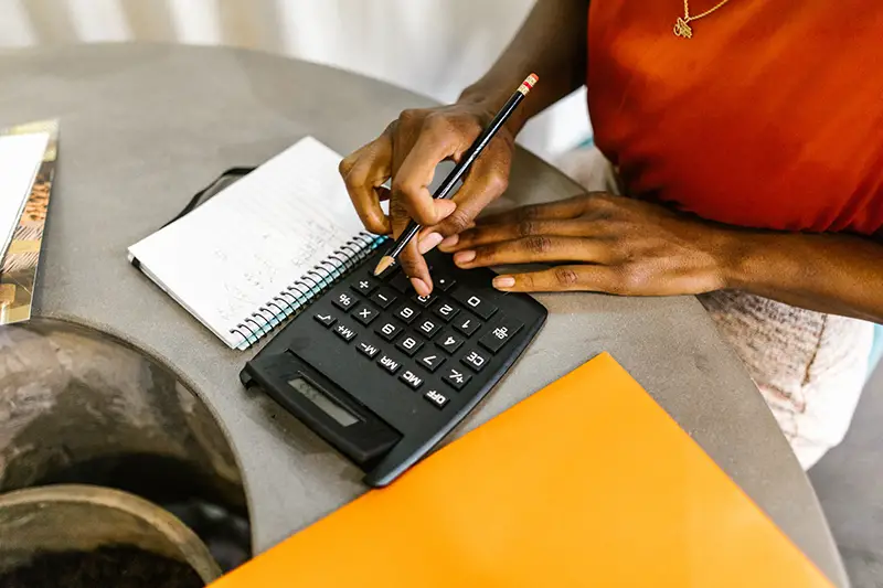 Woman uses calculator