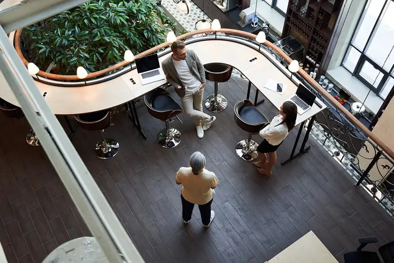 Elevated view of staff talking in the office