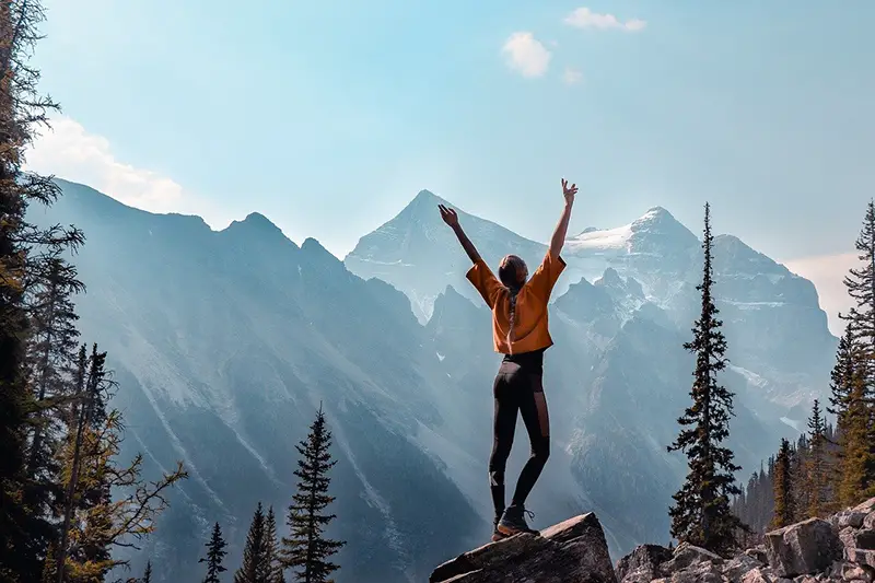 Girl standing near mountains