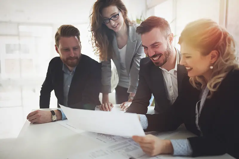 Group of business people collaborating on project in office