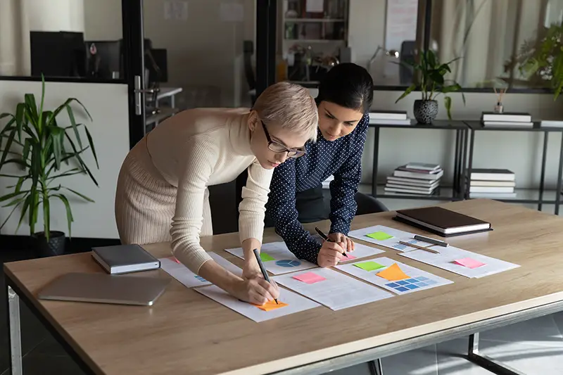 Two women working together in a project