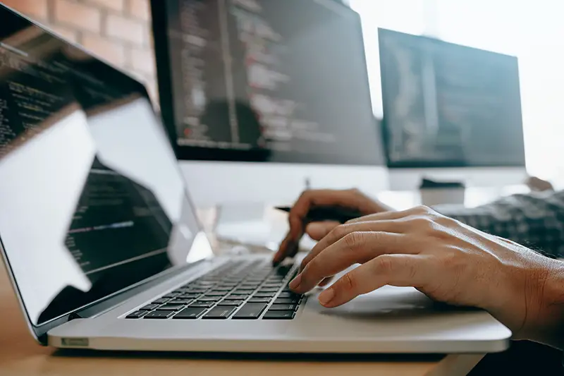 Close up of hands contemporary website developer man typing and writing code