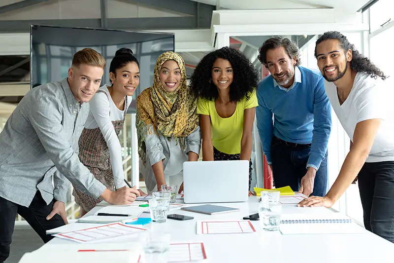 Group of business partners discussing strategies at meeting in office