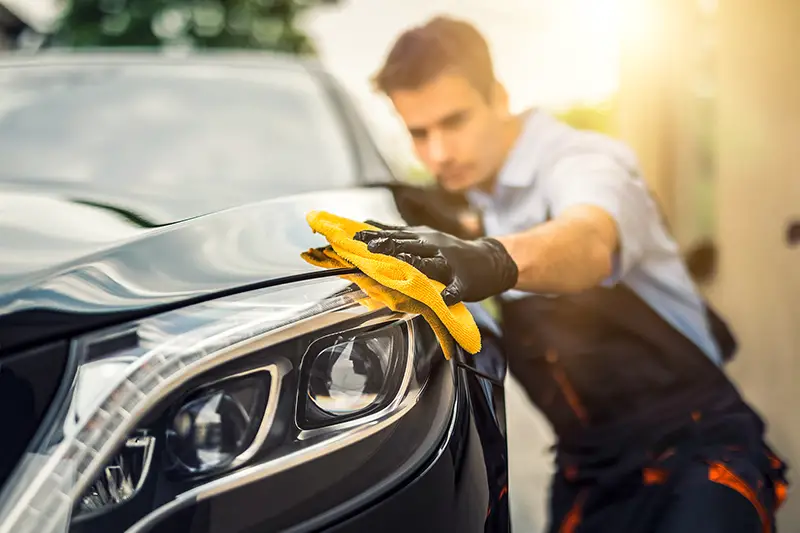 Man polishes the car