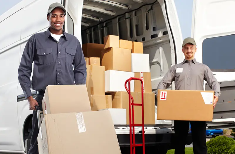 Delivery man near shipping truck