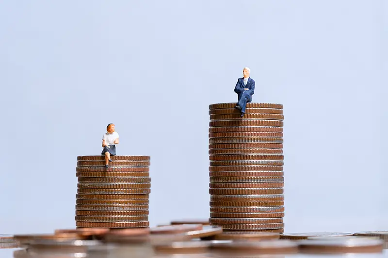 Elderly people sitting on coins stack