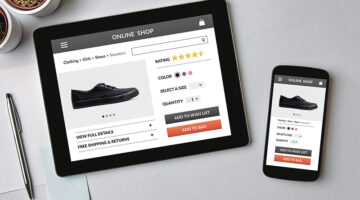 Online shop concept on tablet and smartphone screen over gray table