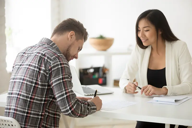 businessman signing contract for business loan