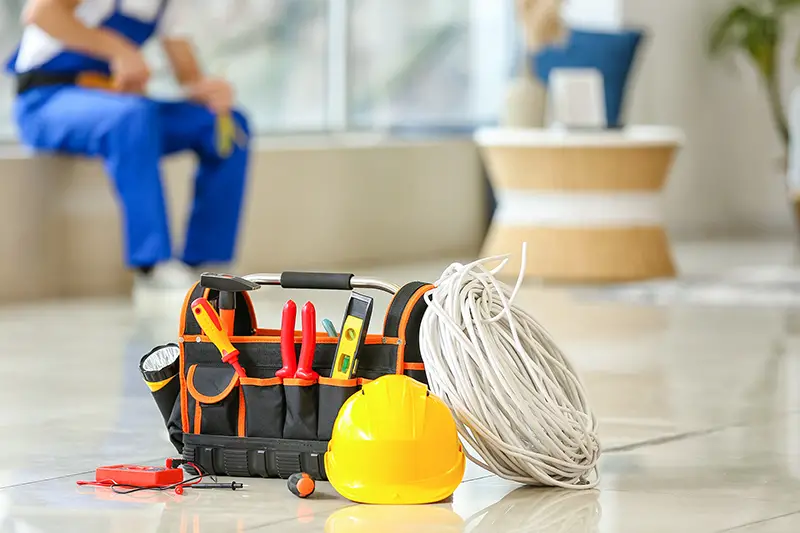 Electrician's tools on floor in room