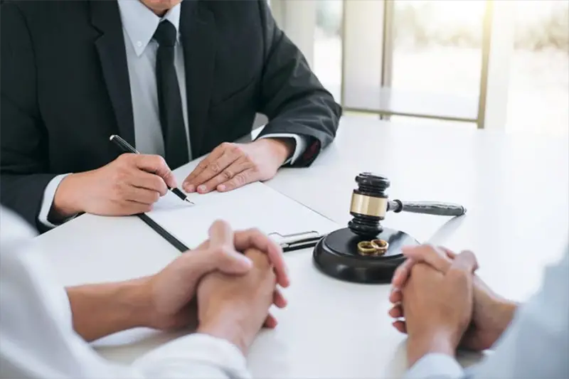 A couple in front of their lawyer