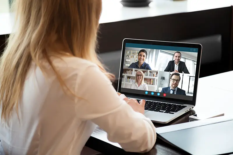 businesswoman speak using Webcam conference on laptop