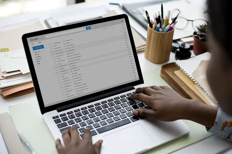 Woman using laptop for checking email