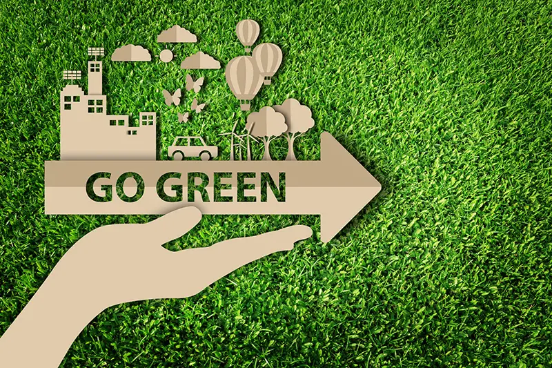 Paper art style of eco on green grass background
