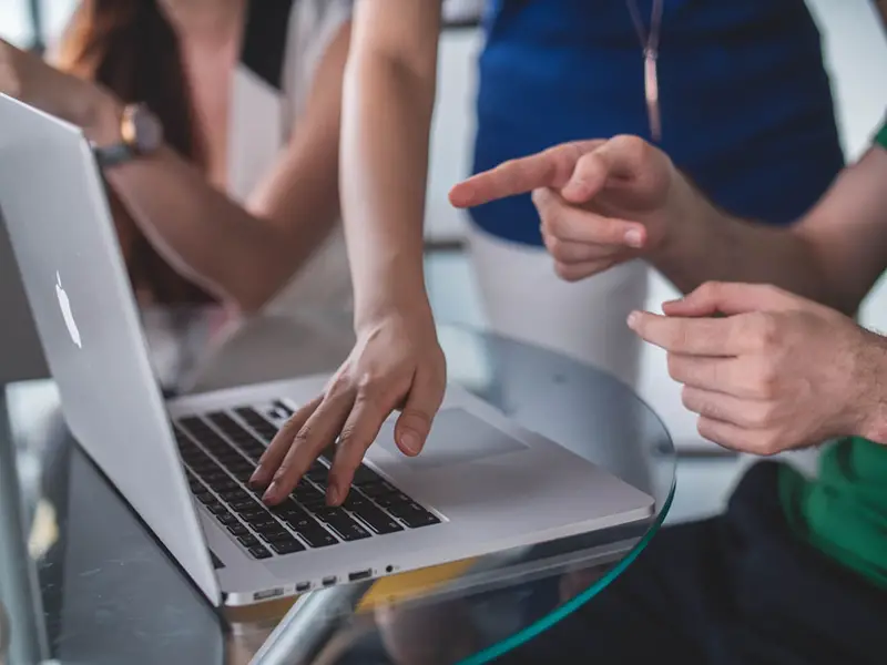 People working in front of laptop