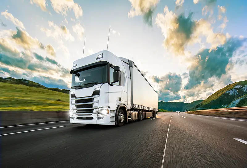 Truck with container on highway