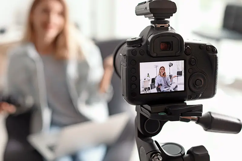 Photo blogger recording video indoors