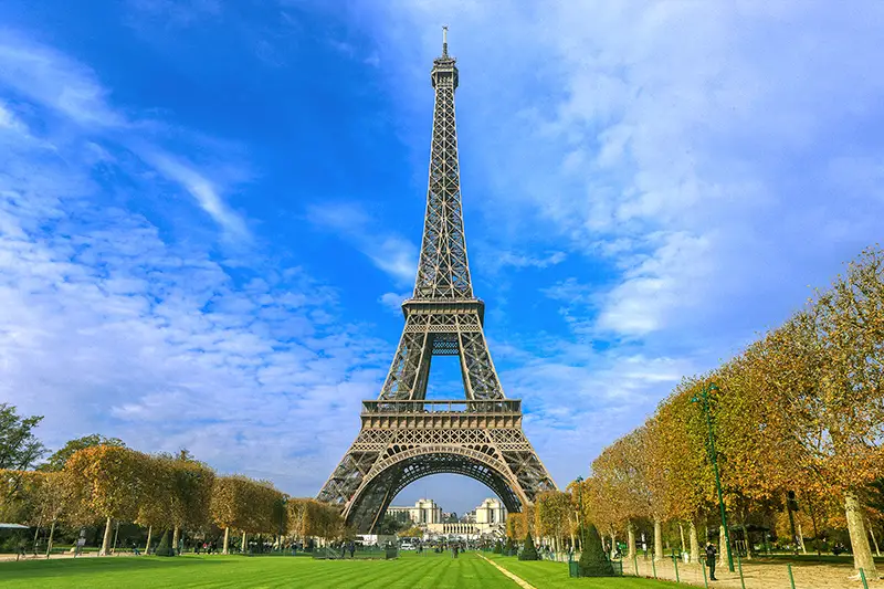 Low angle view of Eiffel Tower with green lawn
