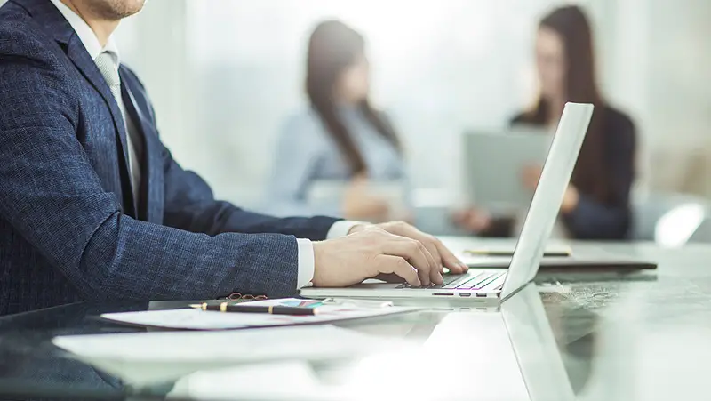 successful businessman working on laptop