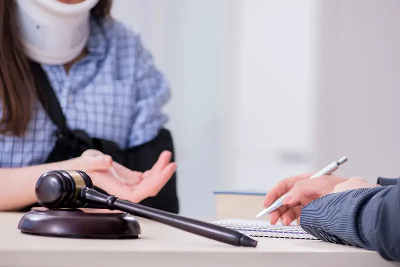 Injured woman talking to a lawyer