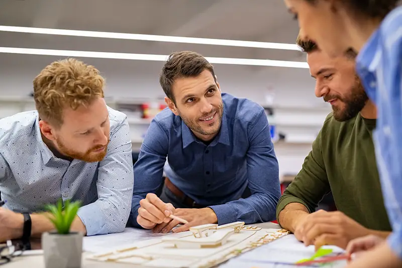 Group of creative people working together in office.