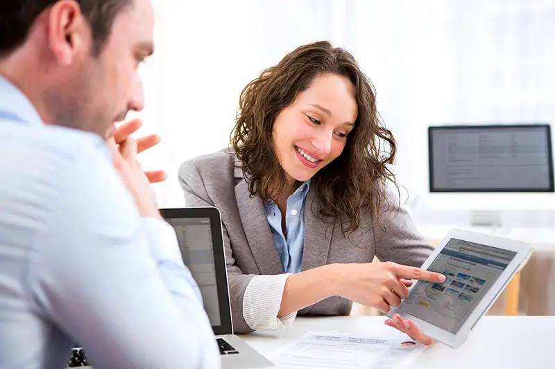 Woman financial advisor talking to a male client