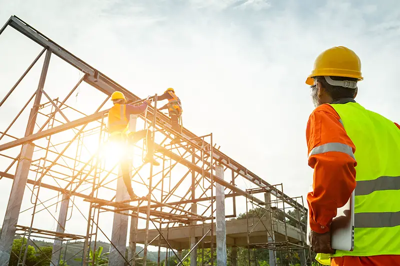 A construction worker control in the construction of roof structures on construction site