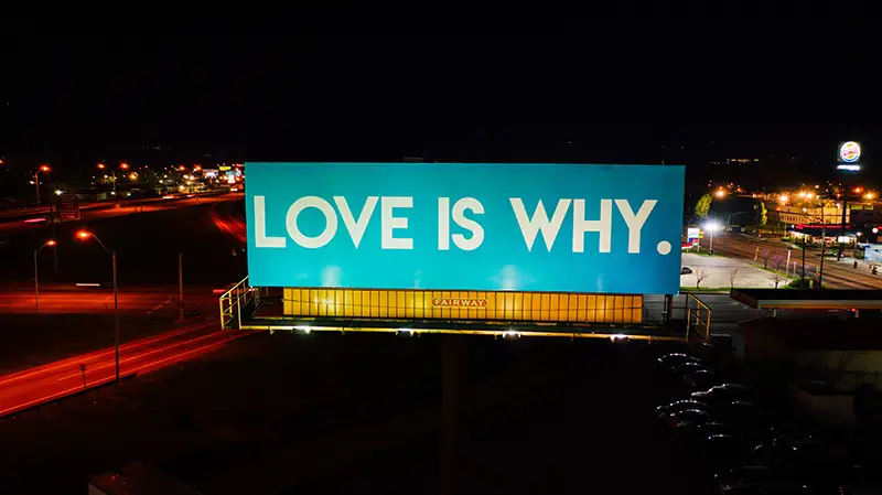 big glowing billboard in a city center