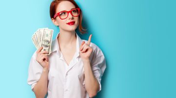 women in red glasses with money on blue background