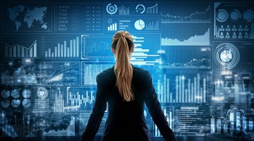 Businesswoman standing in front of big data analytics on virtual screen