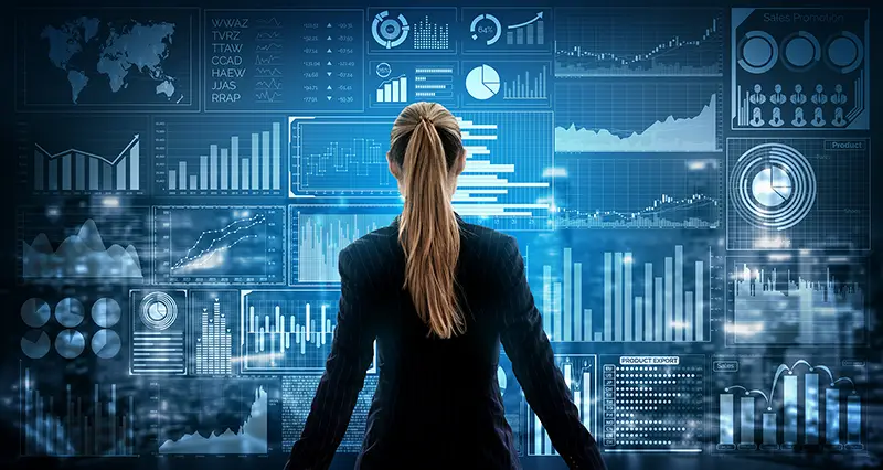 Businesswoman standing in front of big data analytics on virtual screen