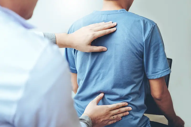 Doctor consulting with patient Back problems