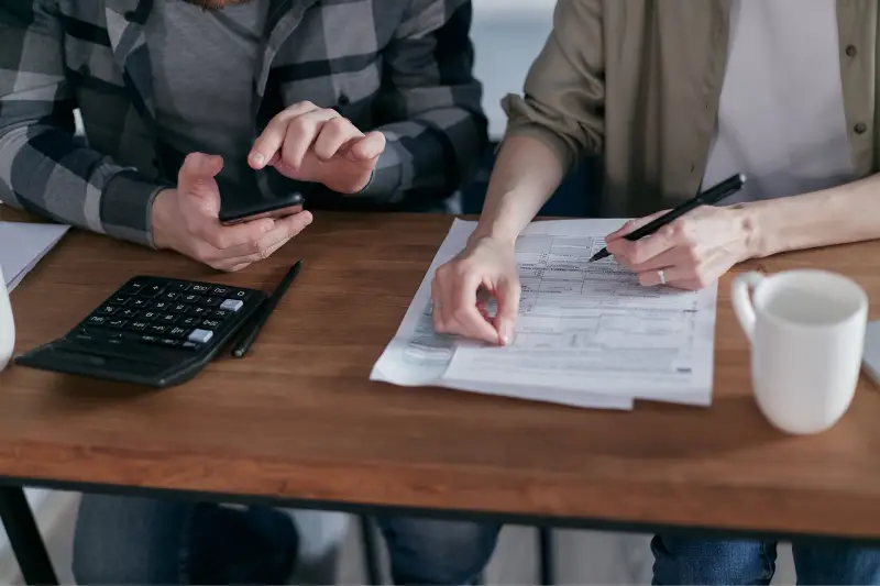 People doing paperwork and computing taxes