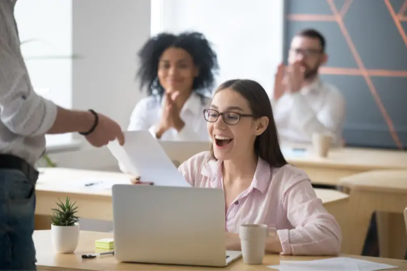 Young female employee receives an appreciation certificate