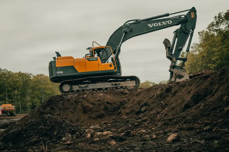 Construction Site with Excavator Digging Dirt