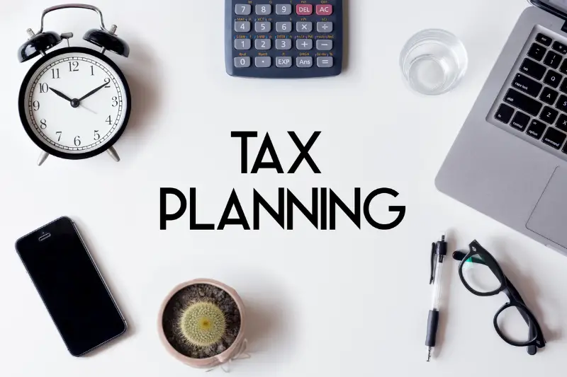 Tax planning words written on white table