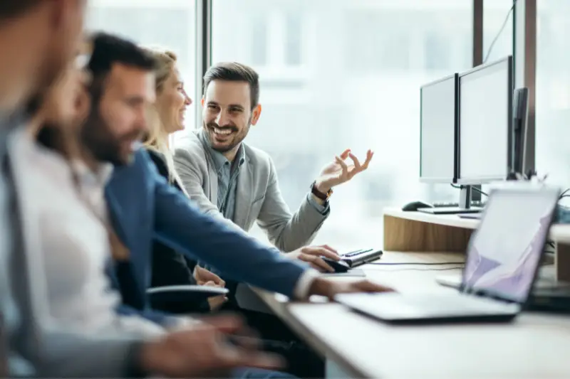 Happy employees working together in office