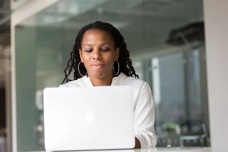 Woman working in front of her laptop computer