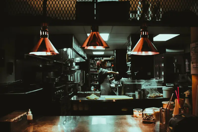 Woman working in the kitchen of a restaurant