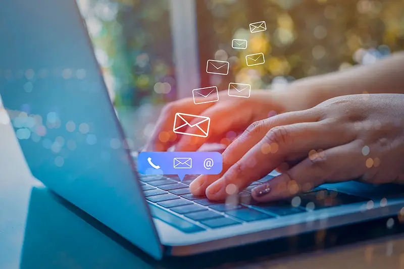 Person typing on computer keyboard