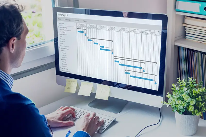 Project manager working on Gantt chart schedule