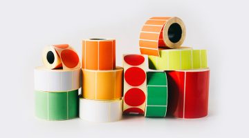 Colored and white reels with self-adhesive