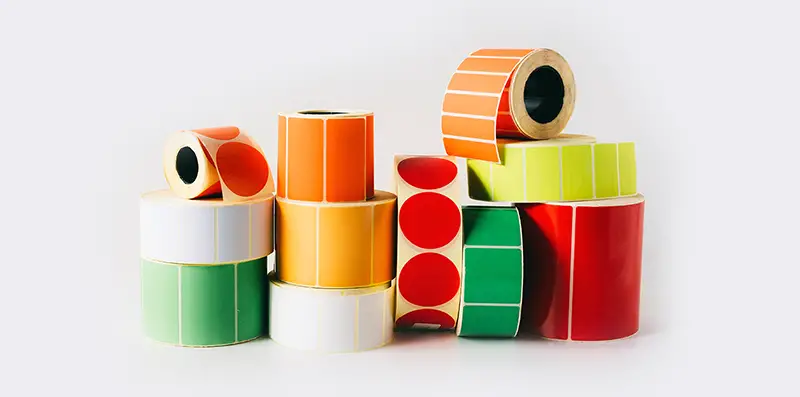 Colored and white reels with self-adhesive