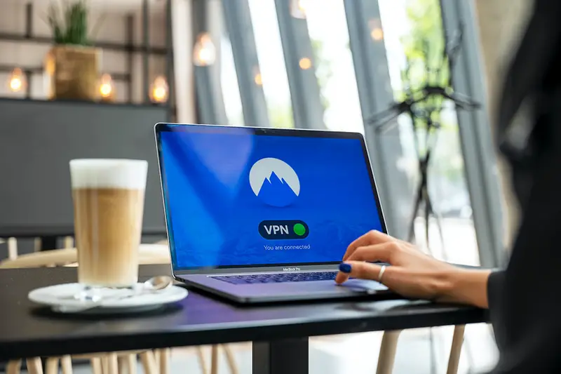 Person using VPN on black laptop