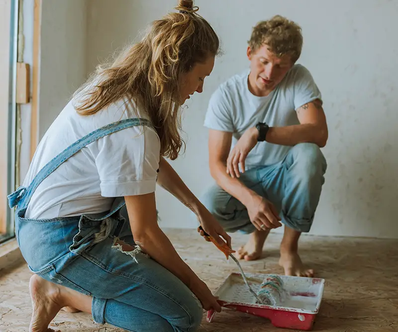 Couple Painting the House Together