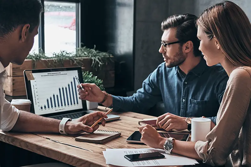 business people analyzing data using computer in the office