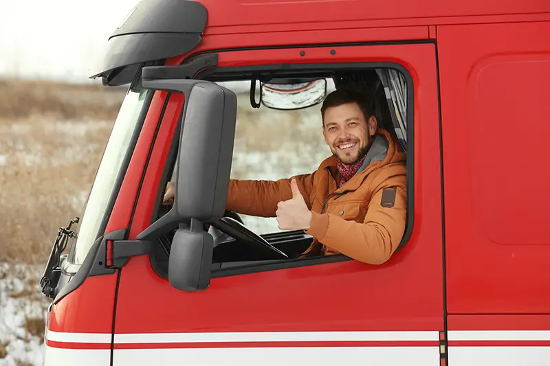 Young man driving big modern truck